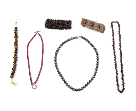 Faceted ruby bead  bracelet, another with tigers eye,  garnet necklace and bracelet, carnelian set silver panel bracelet and 