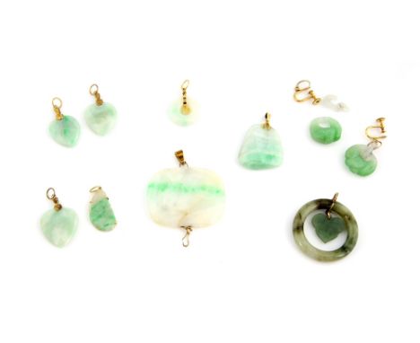 Eight jade pendants, including rectangular shaped panel, measuring 4.3 x 3.5cm, three heart shaped, two in disk form, one car