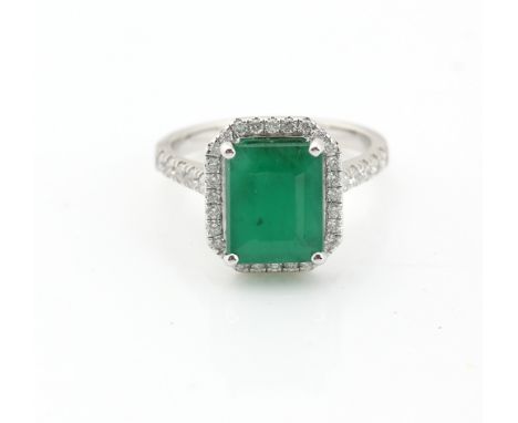 Emerald and diamond ring, rectangular step cut emerald, estimated weight 3.02 carats, mounted in 18 ct white gold diamond set