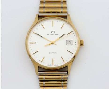 Garrard, a gentleman's gold dress watch the circular  signed dial with gold batons and date at 3, fitted with a signed quartz