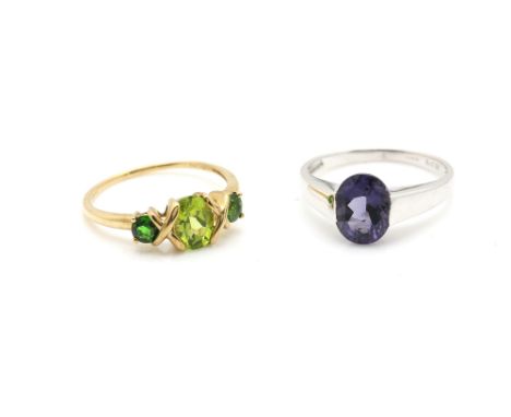 Contemporary white gold ring set with amethyst, and a peridot and diopside three stone ring, mounted in 9 ct yellow gold, bot