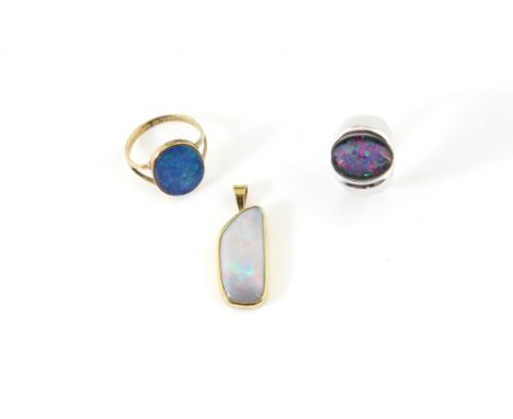 Modern opal triplet ring, mounted in white metal stamped 18 ct, ring size J, freeform opal pendant in rub over setting, measu