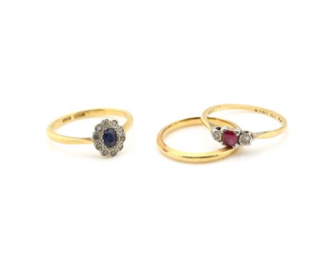 Three rings, one sapphire and diamond cluster, another synthetic ruby and diamond three stone, both size O and a  wedding ban