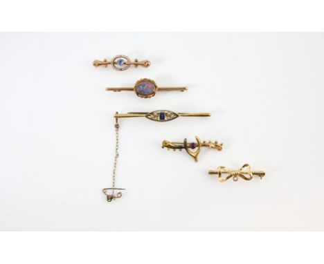 Five bar brooches, one bow motif, in 18 ct, another sapphire and pearl stamped 15 ct, opal doublet and two Victorian paste se