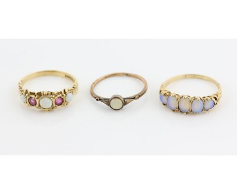 Three opal rings, one five stone, another set with round cut pink sapphires, both size N, single stone ring, size L, all moun