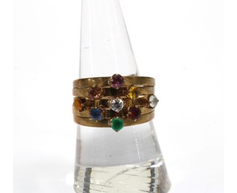 A vintage gemset ring consisting of five gemset bands, stamped 14k