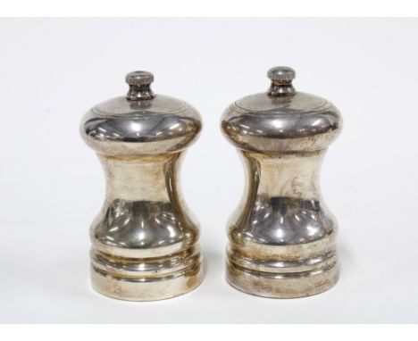 A pair of Mappin &amp; Webb silver pepper grinders, London 1994, 8cm (2)