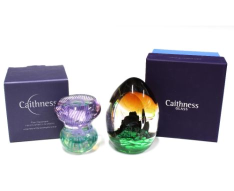 Caithness Glass paperweights to include Edinburgh Castle , 12cm, together with a True Scot thistle paperweight, with boxes (2