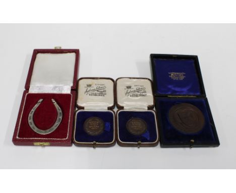 Birmingham silver horseshoe together with  three bronze medallions (4) 