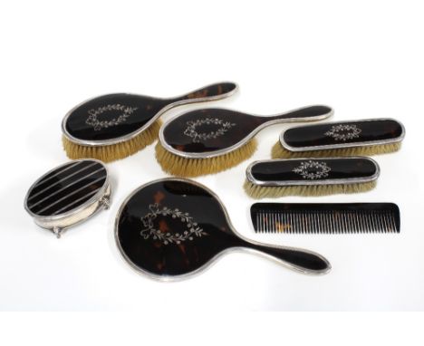 Mappin &amp; Webb silver mounted tortoiseshell dressing table set comprising hand mirror, two hair brushes and two clothes br