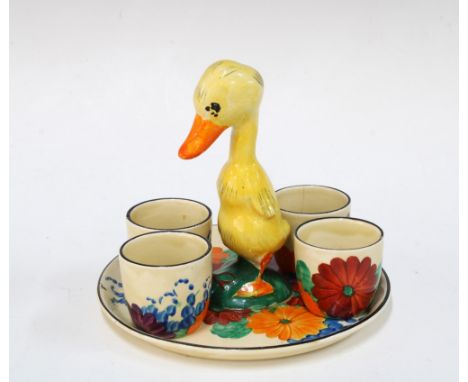 Clarice Cliff Bizarre duck cruet stand in the Gayday pattern, with four Fantasque egg cups, 13cm