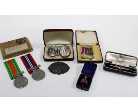 RAF wings brooch, stamped GOLD &amp; SILVER together with WWII DEFENCE and WAR medals with accompanying miniature medals, a h