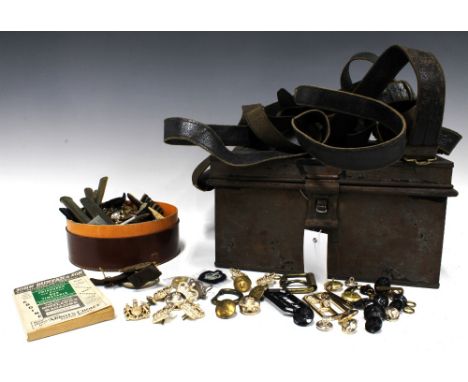 A collection of military buttons, felt badges, leather belts, and other vintage items to include bus conductors badges, etc (