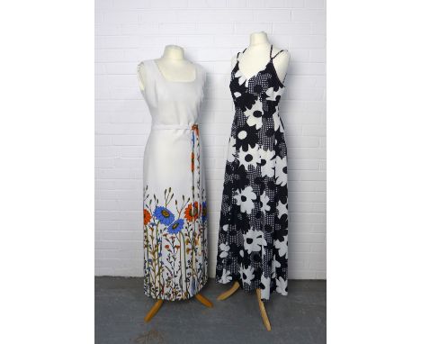 Two vintage dresses to include a black and white dress by Laura Lee, London W1, size 14 and a white dress with floral border 
