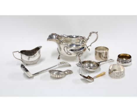 A silver caddy spoon with shell bowl, Birmingham 1966 and a shovel caddy spoon in white metal and  faux ivory, together with 