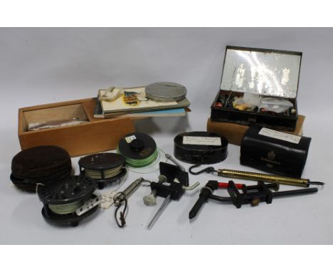 Box containing vintage fishing related items, including reels, The Hardy Book of Flies, tins etc