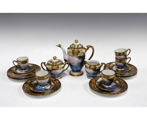 Noritake  porcelain coffee set, handpainted with a lake and swans, with mountains in the distance, with gilded rims,  (one cu