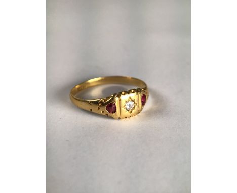 An 18ct gold ruby and diamond ring . 2.5g Size P.