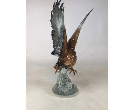 A Hutschenreuther German model of a eagle. Stamped 17 to base. H:45cm Condition: damage to wing tip- signs of restoration