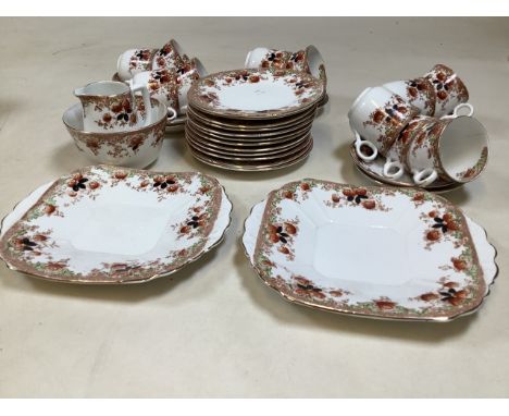 A thirty nine piece Melba China tea set with hand painted detail.