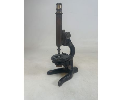 A military issue mid 20th century  horse shoe based microscope, with broad arrow stamp. H:43cm