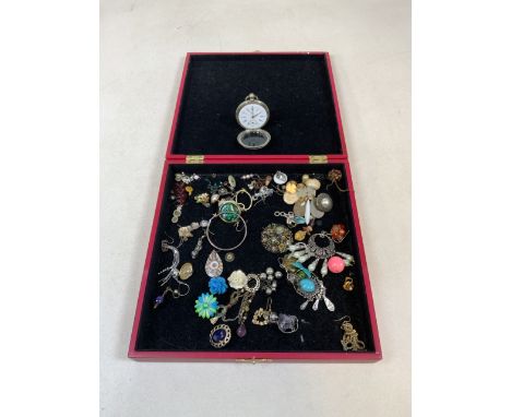 A box of costume jewellery and a modern pocket watch.