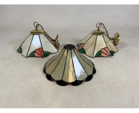 Three glass Tiffany style ceiling light shades.