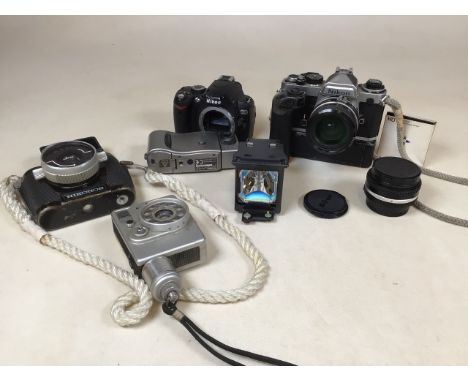 A collection of analog cameras and a bulb. Cameras include NikonOS with a W-Nikkor 1:2,5 F=35mm, no.264414. Canon Dial 35, Ca