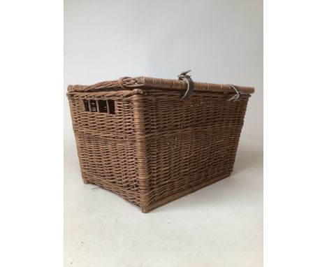 A wicker pigeon basket with two leather straps and wicker carrying handle W:52cm x D:36cm x H:33cm