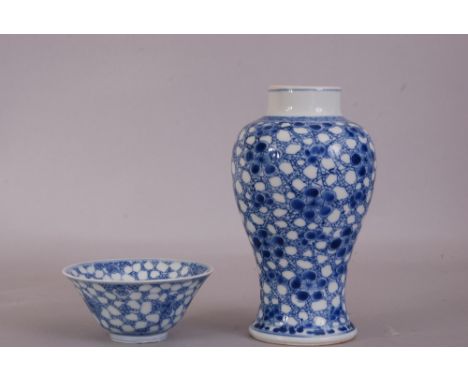 Chinese blue and white baluster vase, painted with prunus on a cracked-ice ground, Kangxi, 17cm high; together with a blue an