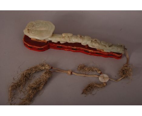 Chinese jade ruyi sceptre, the head carved as a large lingzhi by a bat, the long shaft carved with eight smaller lingzhi grow