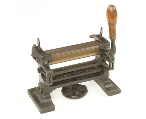 A bench top leather splitting tool with 6 1/2" blade G