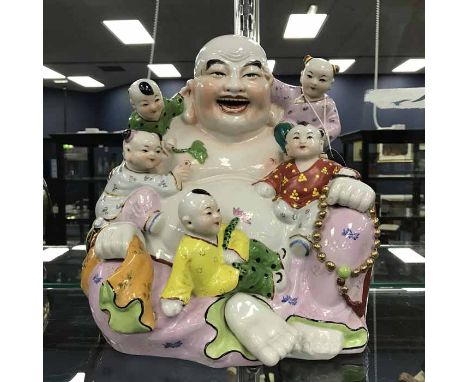 MID 20TH CENTURY CHINESE POLYCHROME CERAMIC BUDDHAmodelled with clambering children, 29cm high 
