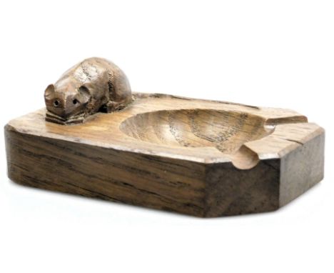 A Robert Mouseman Thompson of Kilburn carved oak ashtray, the mouse with a curved tail, 10cm wide.