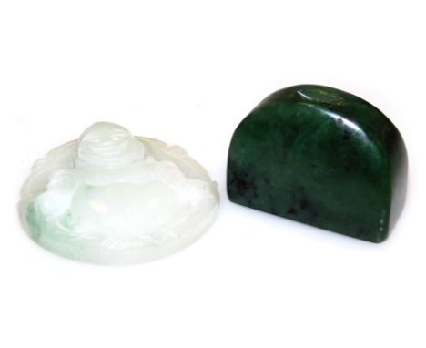 A jadeite pendant carved as the Happy Buddha, 5.5cm high, and a spinach jade carving, possibly a brush rest. (2)
