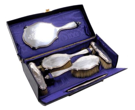 A George V silver backed six piece dressing table set, for W Batty &amp; Sons Limited, Manchester and Liverpool, with engrave