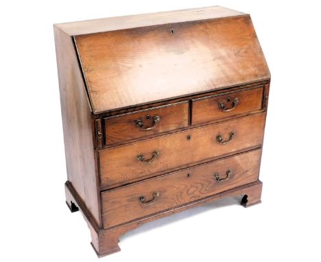 A George III oak bureau, the fall flap above two short over two long drawers, raised on bracket feet, 106cm high, 98cm wide, 