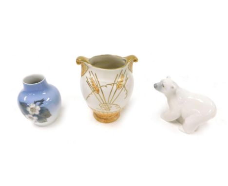 A Lladro porcelain figure of a polar bear, Fieldings Crown Devon pottery Art Deco vase, of twin handled semi fluted form, tub