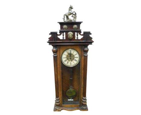 A late 19thC Continental mahogany cased wall clock, circular brass dial embossed with flowers, with and chapter ring bearing 