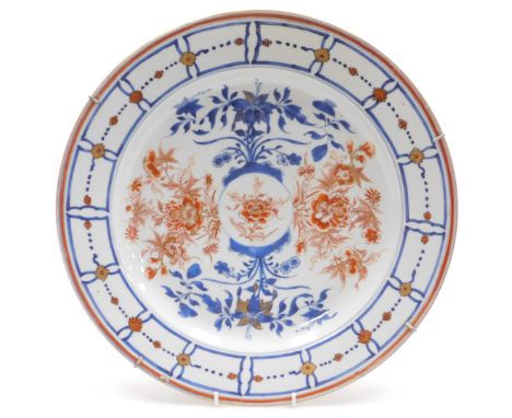 A Kangxi porcelain Imari charger, painted with flowers, within a panelled and flower head border, verso floral sprigs, 39cm w