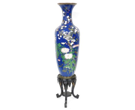 A Japanese Meiji period blue ground cloisonne enamel vase, of shouldered, tapering form, decorated with an eagle, flowers and