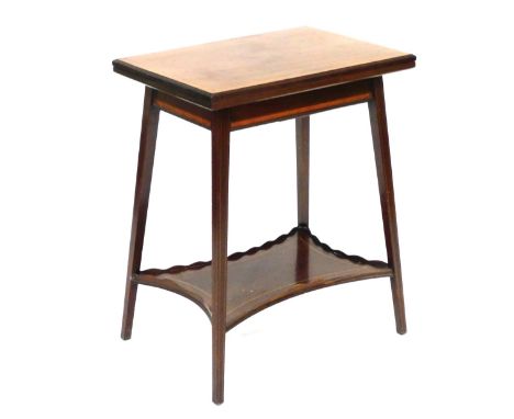 An Edwardian mahogany and satinwood crossbanded fold over card table, raised on slender square legs united by shaped undertie