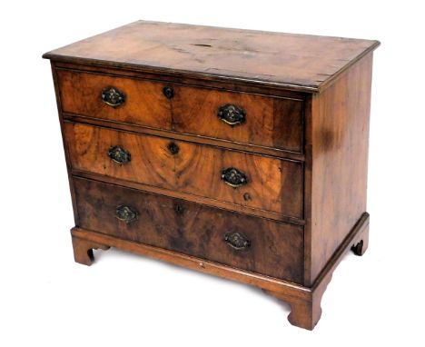 A George III mahogany chest, of three long graduated drawers, raised on bracket feet, 86cm high, 105cm wide, 59cm deep.