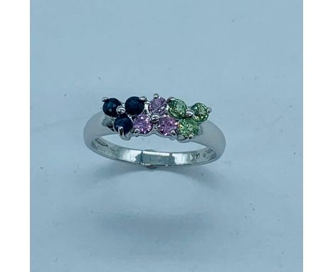 14 k White gold ring set with three sets of gems in pink, blue and green. Size M.