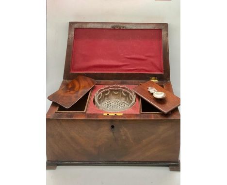 A mahogany tea caddy with glass mixing bowl and lion handles 