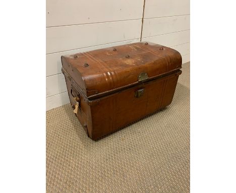 A metal trunk with stud work to lid 