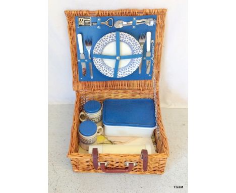 A vintage wicker picnic hamper