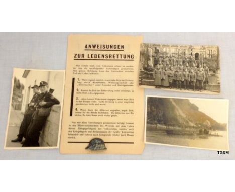 Three WW2 German photos including the surrender of the U-Boat U1023 with a Der Stalhelm metal badge and a German leaflet
