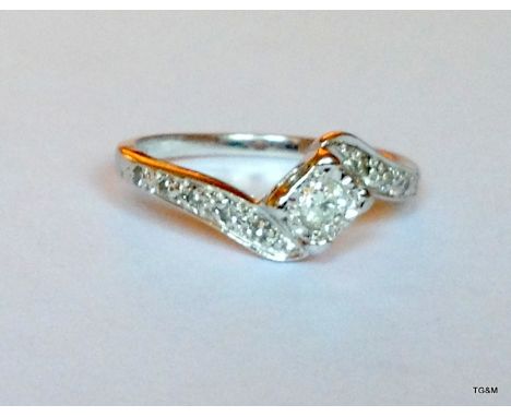9ct white gold diamond solitaire with cross over shoulders, size J / K