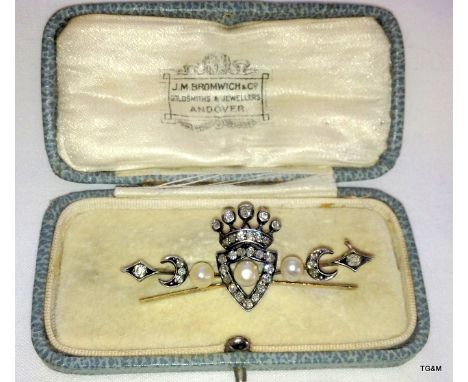 A ladies diamond and pearl brooch in the form of a crown and crescent in old cut diamonds